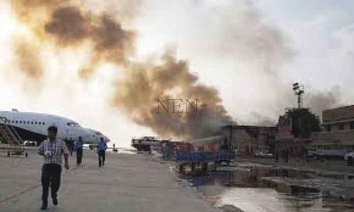 A truck hit a parked plane at Karachi Airport.